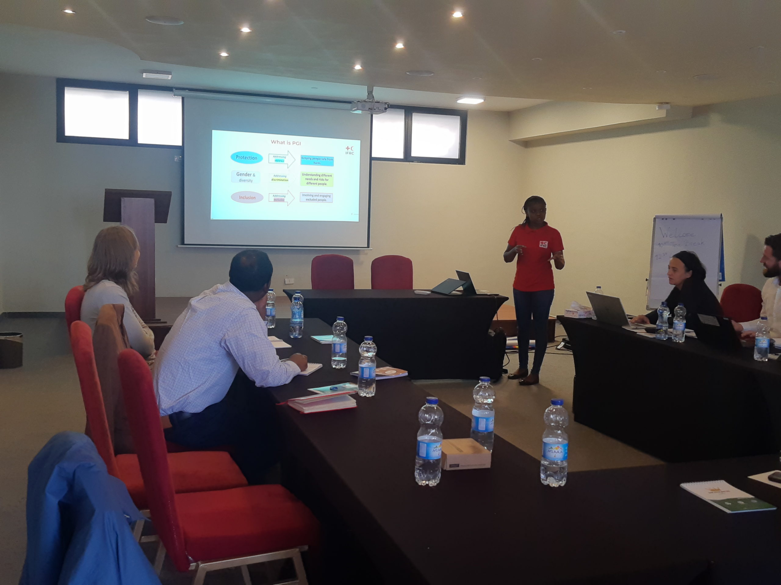 Image showing Milanoi Koiyiet, Senior PGI Officer at IFRC, providing presentation on PGI